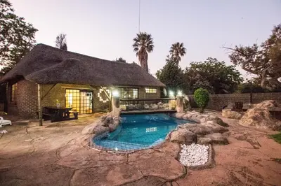 a house with a swimming pool in the yard at The Guest Villa in Benoni