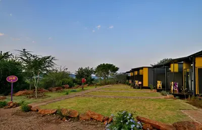 a row of houses in a field with a yard at SleepOver Punda Maria Gate in Punda Maria