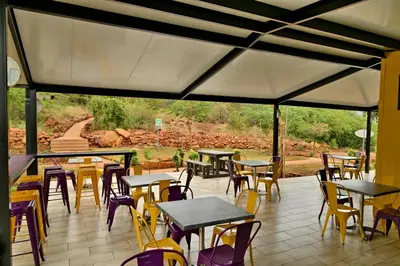 a group of tables and chairs on a patio at SleepOver Punda Maria Gate in Punda Maria