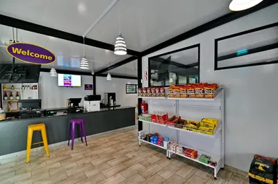 a view of a store with a welcome sign and a counter at SleepOver Punda Maria Gate in Punda Maria
