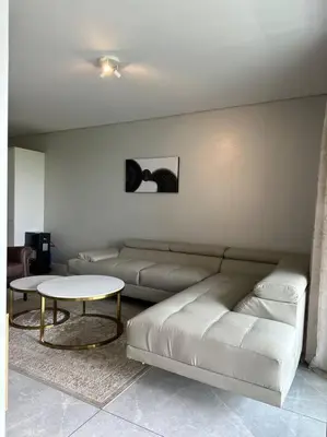 a living room with a couch and a table at House of Grace with Backup power Next to OR Tambo in Kempton Park