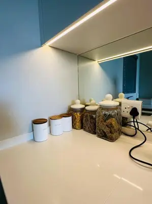 a room with a row of jars and a mirror at House of Grace with Backup power Next to OR Tambo in Kempton Park