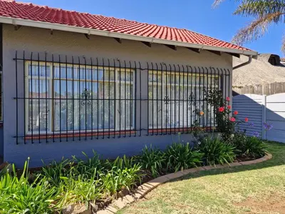 a gate on the side of a house at Botle Hive in Kempton Park