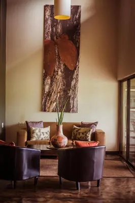 a living room with a couch and a table at Bushveld Terrace Safari Hotel, Lodge & Spa in Phalaborwa