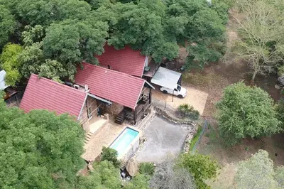 an overhead view of a house with a red roof at Serenity Farm House in Karino