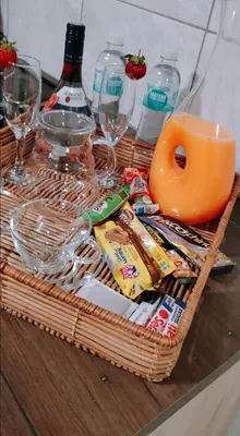 a basket filled with food and drinks on a table at Reutlwane Gardens Apartments in Secunda