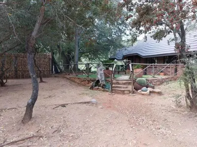 a playground in a yard next to a house at Tumuga Private Cottage Mokopane in Amatava