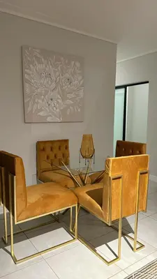 two chairs and a table in a room at The Blyde Crystal Lagoon Luxury Stays in Pretoria