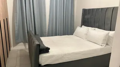 a bed with white sheets and pillows in a bedroom at The Blyde Crystal Lagoon Luxury Stays in Pretoria