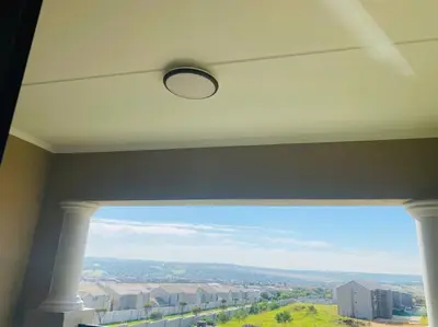 a window in a room with a view of a city at LuxuryHome in Midrand