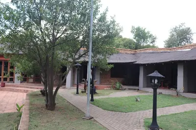 a building with a street light in front of it at Umnotho We Afrika House in Erasmus