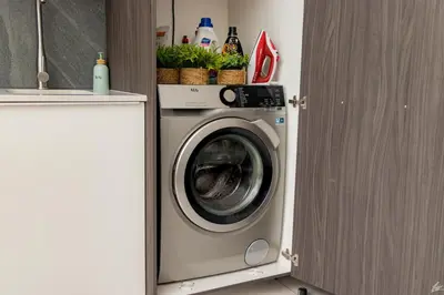 a washer and dryer in a kitchen with at Menlyn Maine Luxury Apartments - Penthouse 1217 in Pretoria