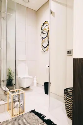 a bathroom with a glass shower and a tub at Menlyn Maine Luxury Apartments - Penthouse 1217 in Pretoria