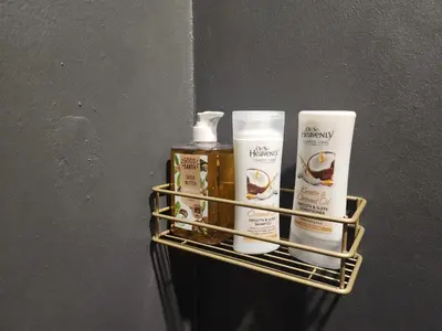 a rack with four products on a wall at @241 Enkeldoorn Guesthouse in Pretoria