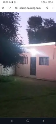 a house with the sun shining through the windows at First derby Lodge in Benoni