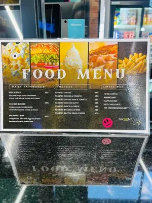 a sign for a food menu in a store at Greencreek Riverwalk in Pretoria