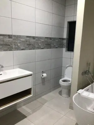 a bathroom with a sink and a toilet at The 314 Euphoria Golf Estate in Naboomspruit