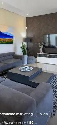 a living room with a couch and a coffee table at Luxurious 2 bedroom @ The Regency Hotel in Pretoria
