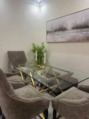 a glass table and chairs in a room at Midrand Chic Oasis in Midrand