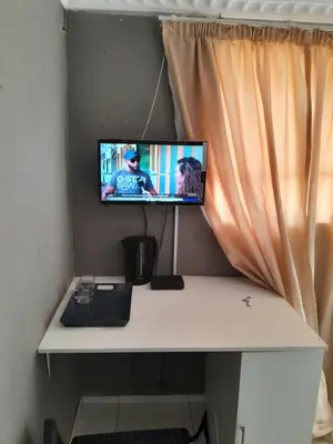 a computer monitor sitting on top of a desk at Letz Guest Lodge in Bochum