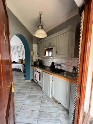 a kitchen with a sink and a counter top at Dullies Dolce in Dullstroom