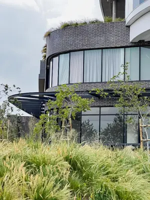 a building with plants on the side of it at ERL Ellipse Waterfall. in Midrand