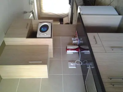a small bathroom with wooden cabinets and a scale at Airport Lodge Guest House in Kempton Park