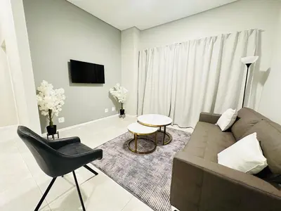 a living room with a couch and a table at Shamah in Pretoria