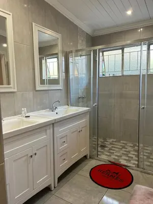 a bathroom with a sink and a shower at Lebamboo On Protea in Pretoria