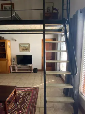 a bunk bed with a ladder in a room at BLessing at Lynnwood in Pretoria