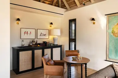 a living room with a table and a couch at Monwana in Thornybush Game Reserve