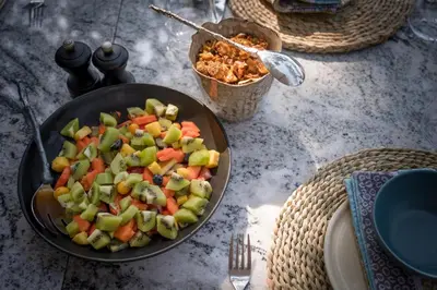 a bowl of vegetables in a pan on a table at Serondella Safari Lodge in Thornybush Game Reserve