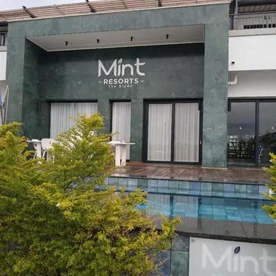 a building with a sign that reads mint records at The Blyde: 2-Bed Luxe Apartment in Pretoria