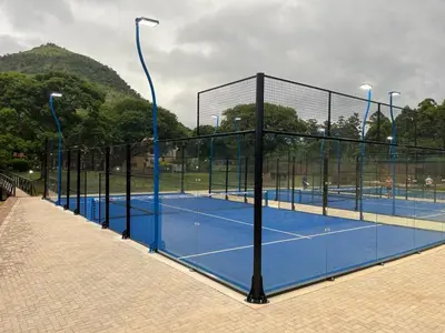 a group of tennis courts on a tennis court at Malaga Hotel in Panorama