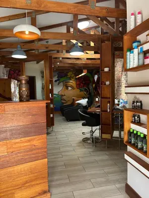 a salon with a painting of a woman on the wall at Pebble Fountain Guesthouse in Pretoria