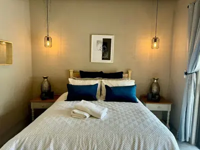 a bedroom with a bed with two towels on it at Rhino Valley in Nelspruit