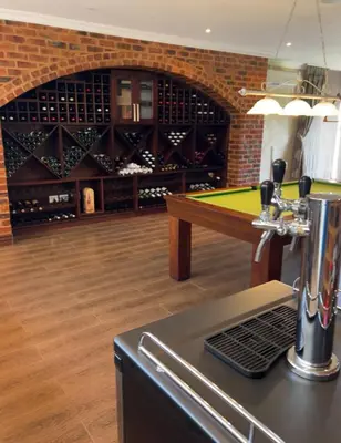 a bar with a pool table in a wine cellar at Mountain Haven in Pretoria