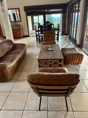 a living room with a couch and a coffee table at Mountain Haven in Pretoria