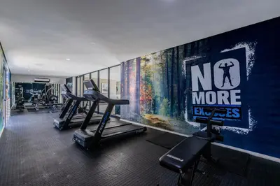 a gym with two tread machines and a no more sign on the wall at The Resting Nest Delight in Midrand
