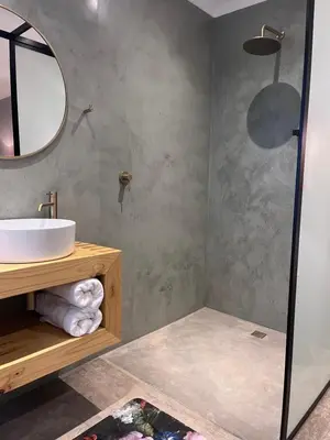 a bathroom with a sink and a mirror at Frere Guesthouse in Ermelo