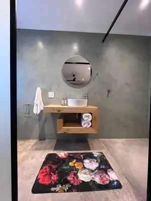 a bathroom with a sink and a mirror at Frere Guesthouse in Ermelo