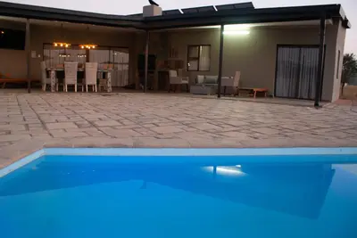 a house with a swimming pool and a patio at Casa de la Presa 3 in Polokwane
