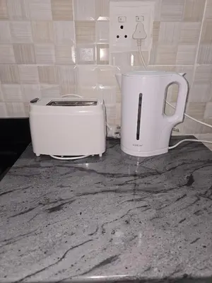 a toaster and a toaster sitting on a counter at Peshline Guest House Unit 2 in Ermelo