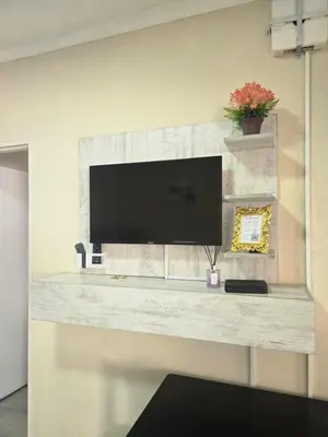 a flat screen tv sitting on top of a wall at Peshline Guest House Unit 2 in Ermelo