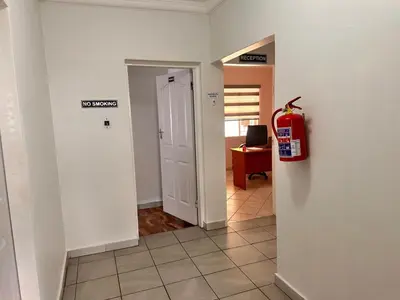 a hallway with a fire hydrant in a room at Creekside Guest House Middelburg in Middelburg