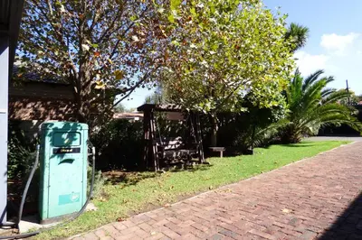 a green electricity box sitting on the side of a street at Pennylane Guest House in Ermelo