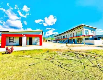 a group of buildings with a lot of electricity at Monavy Riverside Hotels in Tzaneen in Lenyenye