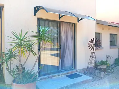 a door to a house with plants in front of it at OR Tambo Stay Unit 4 in Boksburg