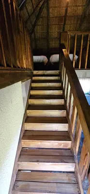 a wooden staircase leading up to a room at Elias Nefale Eco Estate in Mitxetweni