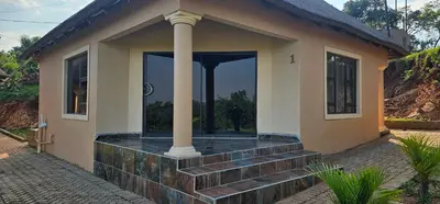 a house with a porch with a column at Elias Nefale Eco Estate in Mitxetweni